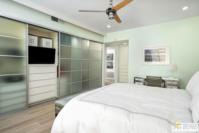 bedroom featuring ceiling fan and light hardwood / wood-style floors