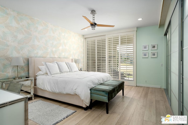 bedroom featuring light hardwood / wood-style flooring and ceiling fan