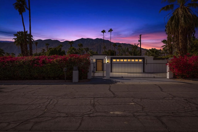 view of front of house with a garage and a mountain view