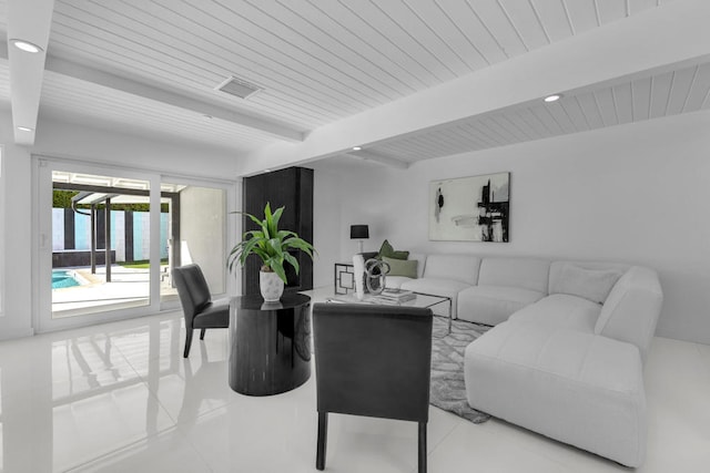 living room featuring light tile patterned floors and beam ceiling