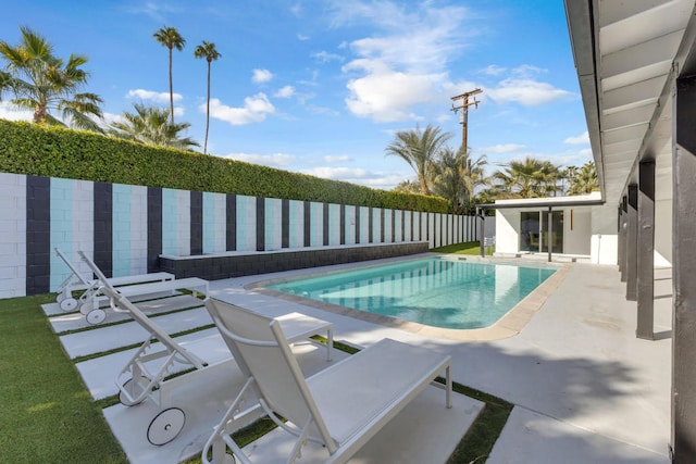 view of swimming pool with a patio area