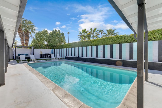 view of pool featuring a patio