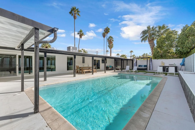 view of swimming pool with a patio area