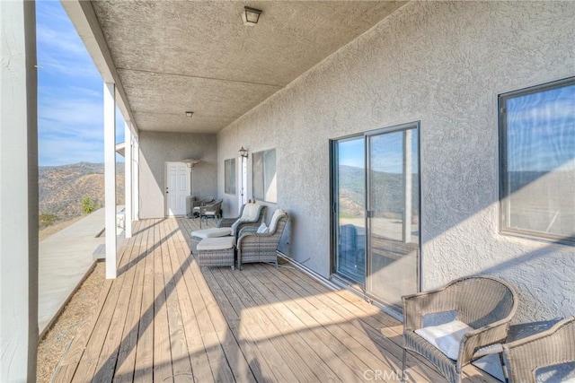 wooden deck featuring a mountain view