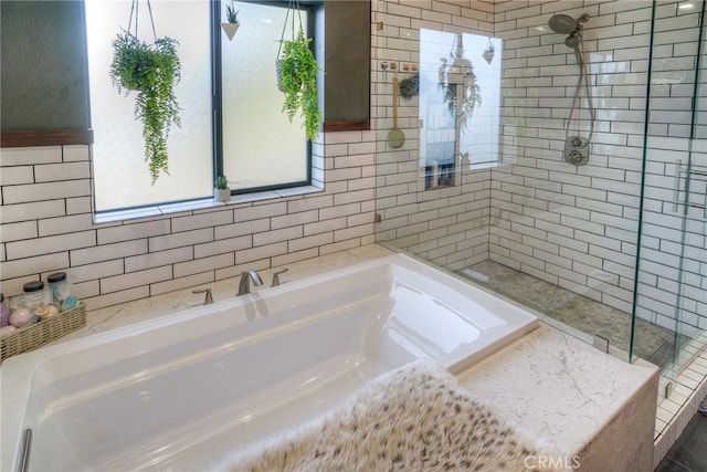 bathroom with a tub to relax in