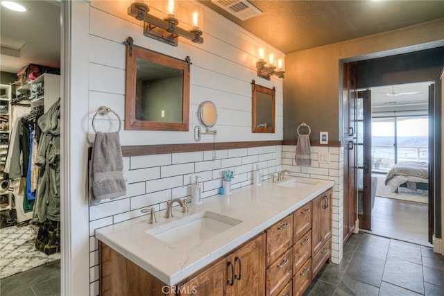 bathroom featuring decorative backsplash, vanity, and wood-type flooring