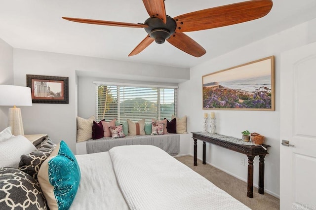 bedroom featuring light carpet and ceiling fan