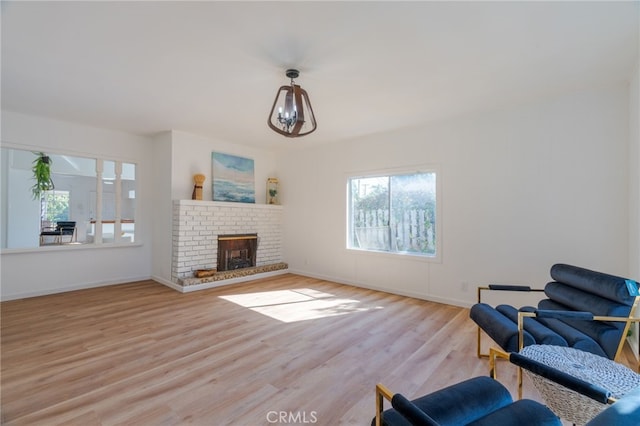 living room featuring light hardwood / wood-style floors and a fireplace