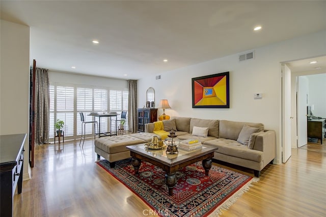 living room with light hardwood / wood-style flooring