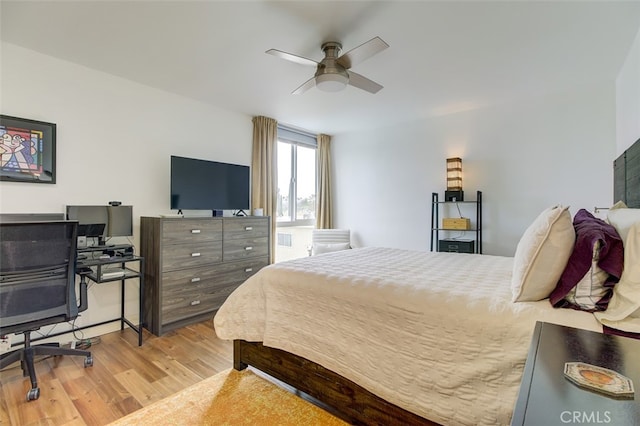 bedroom with a ceiling fan and wood finished floors