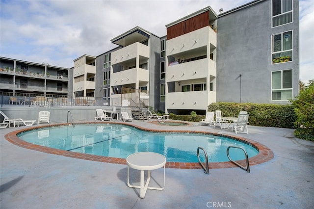 view of pool featuring a community hot tub