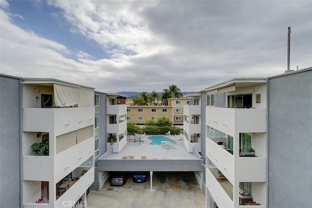 view of property featuring a community pool