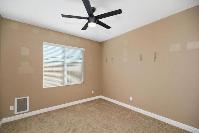 unfurnished room with ceiling fan and light colored carpet