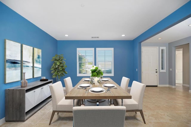 dining space with light tile patterned flooring