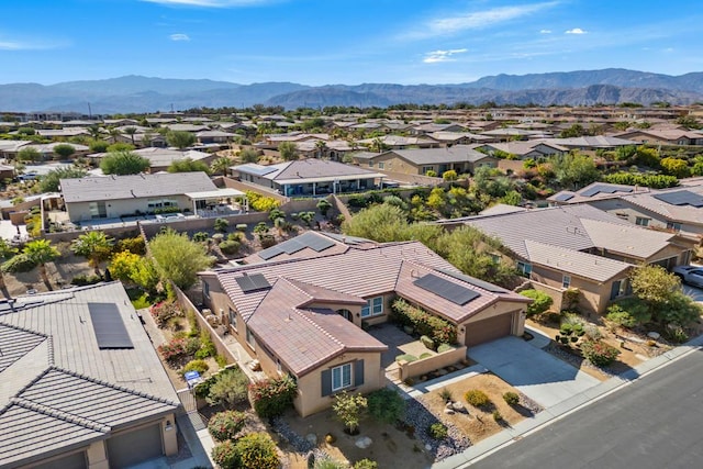 birds eye view of property with a mountain view