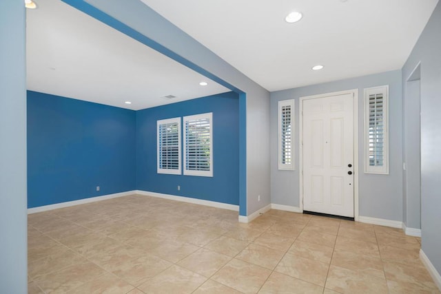 entrance foyer featuring light tile patterned flooring