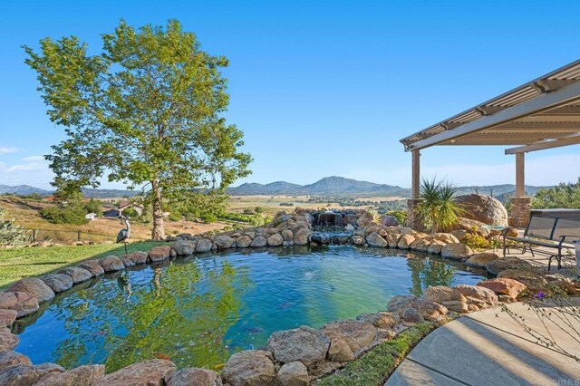 view of pool with a mountain view