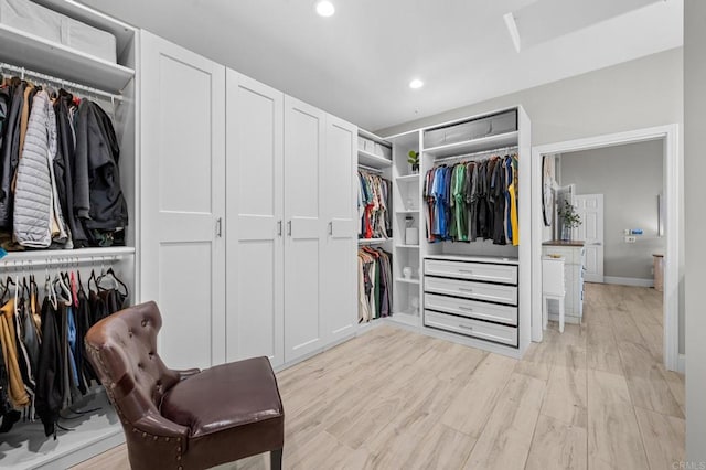 walk in closet featuring light wood-type flooring