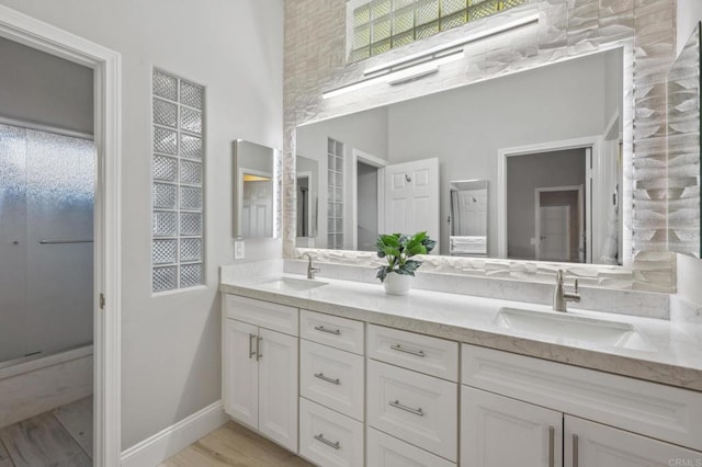 bathroom featuring vanity and hardwood / wood-style flooring