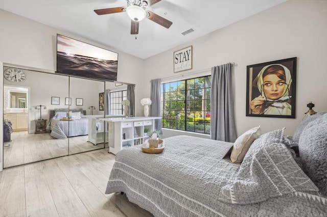 bedroom with ceiling fan and light wood-type flooring