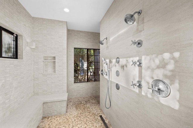 bathroom featuring a tile shower