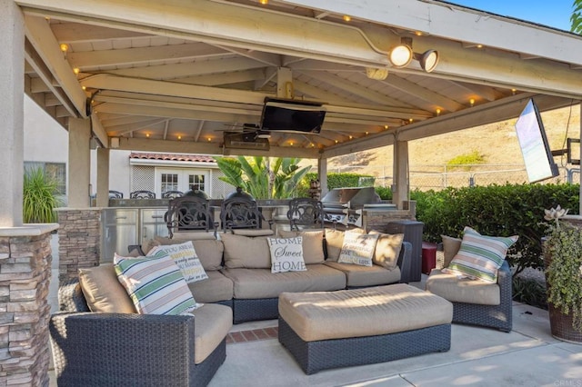 view of patio with a gazebo, area for grilling, an outdoor hangout area, and grilling area