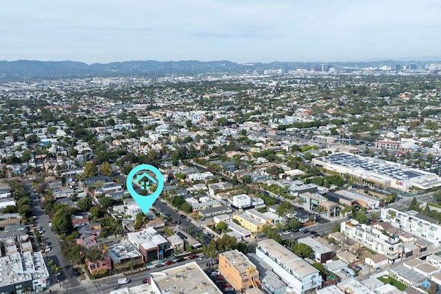 birds eye view of property featuring a mountain view