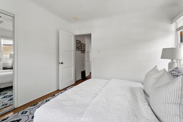 bedroom with wood-type flooring