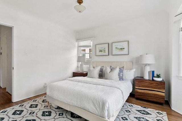 bedroom with wood-type flooring