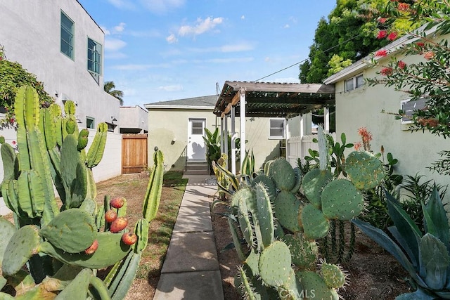 back of house with a pergola