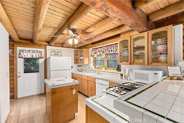 kitchen featuring white appliances, light wood-type flooring, tile counters, a kitchen island, and wood ceiling