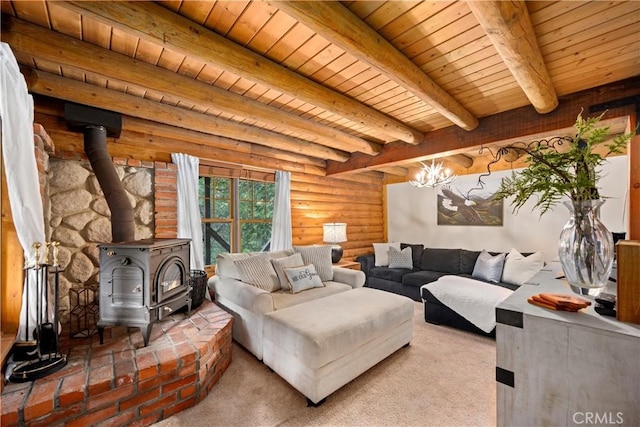 carpeted living room with beamed ceiling, a wood stove, log walls, and wooden ceiling