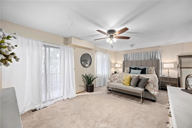 carpeted bedroom featuring access to exterior and ceiling fan