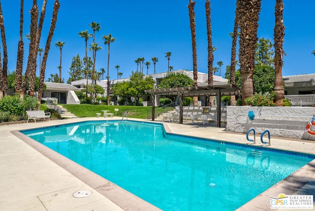 view of swimming pool featuring a pergola, a patio area, and a lawn