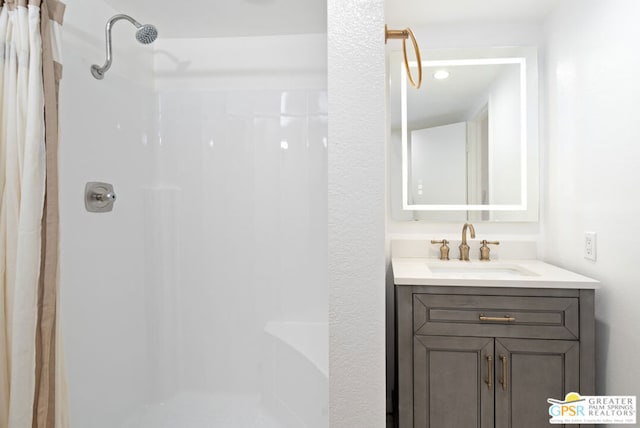 bathroom with vanity and walk in shower