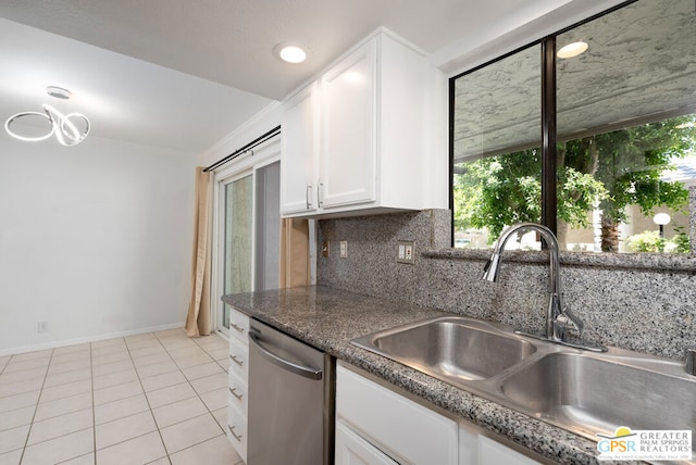 kitchen featuring decorative backsplash, white cabinets, sink, dishwasher, and light tile patterned flooring