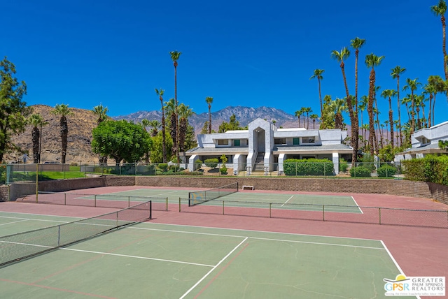 view of tennis court with a mountain view and basketball court