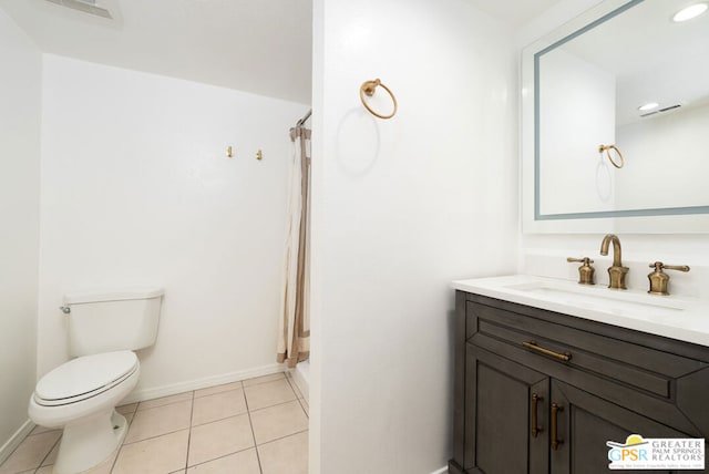 bathroom featuring tile patterned floors, a shower with curtain, vanity, and toilet