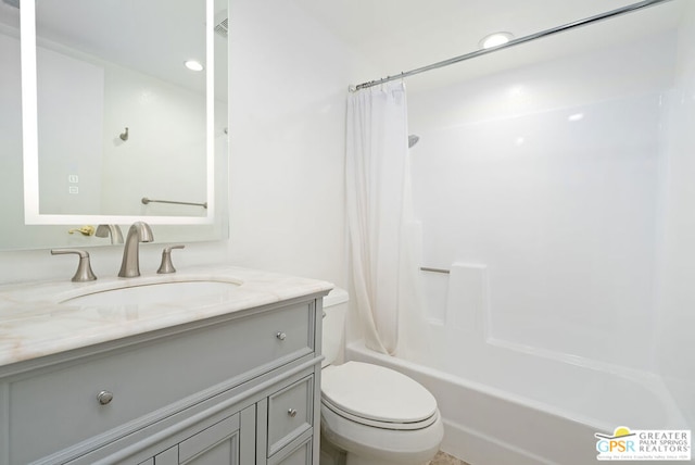 full bathroom featuring shower / bath combo with shower curtain, vanity, and toilet