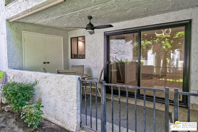 exterior space featuring ceiling fan