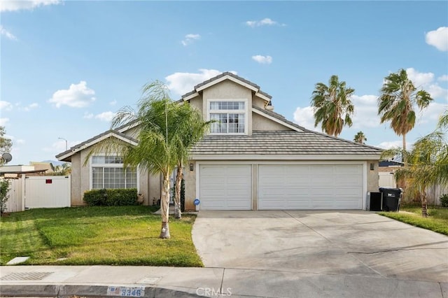 view of front facade featuring a garage and a front lawn