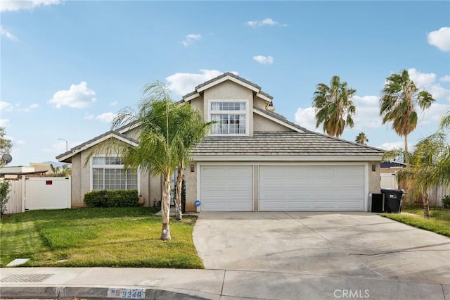 view of front of home featuring a garage and a front lawn