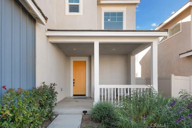 doorway to property featuring a porch