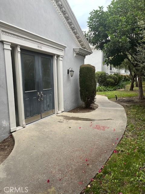 view of exterior entry featuring french doors