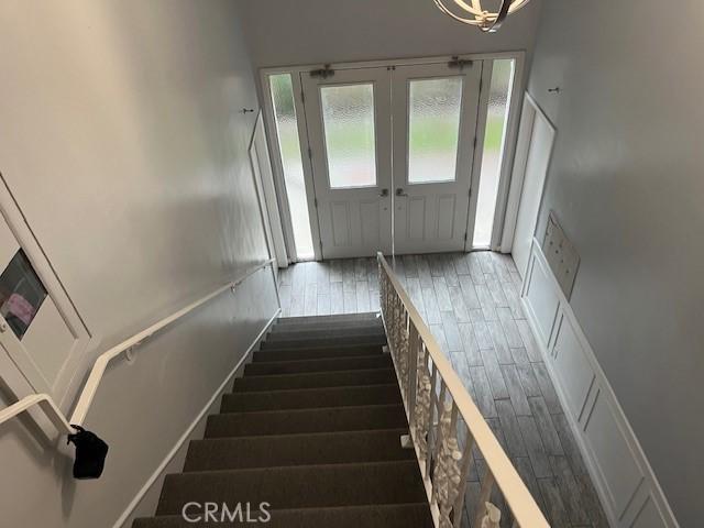 staircase featuring hardwood / wood-style floors