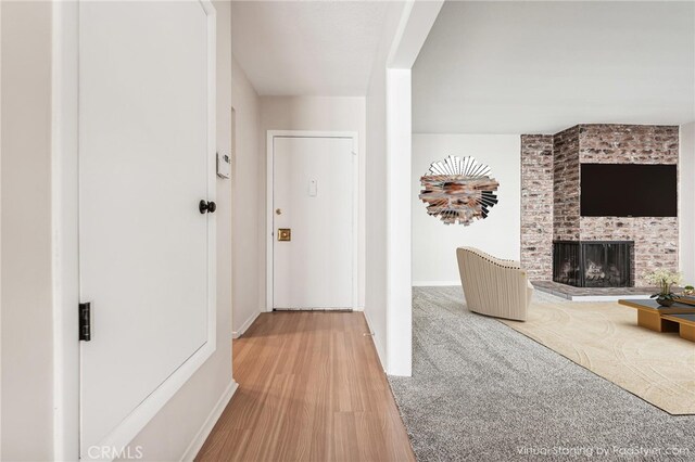 hallway with hardwood / wood-style flooring