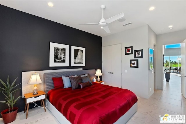 bedroom featuring ceiling fan and a closet