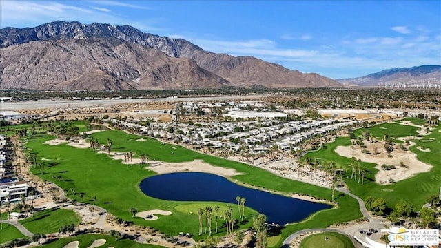 drone / aerial view featuring a water and mountain view