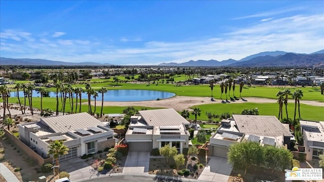 drone / aerial view featuring a water and mountain view