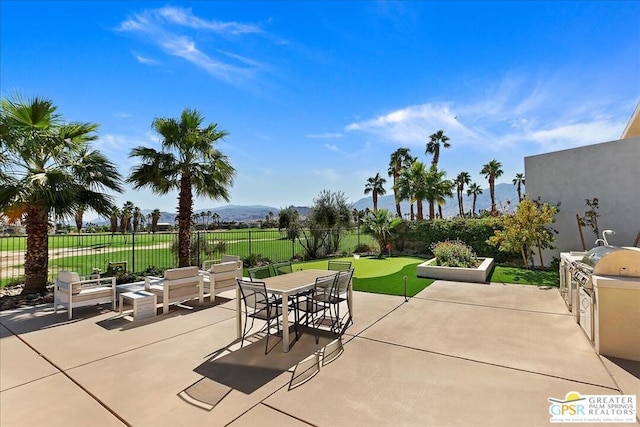 view of patio / terrace with a mountain view